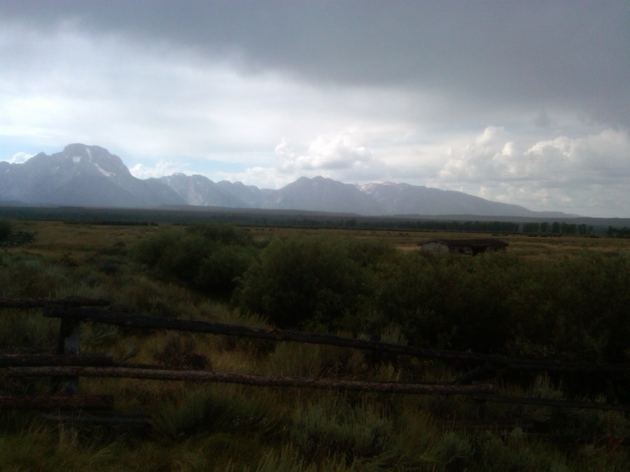 /home/wpcom/public_html/wp-content/blogs.dir/3e6/17878083/files/2011/08/cunningham-cabin-in-tetons.jpg Cunningham Cabin in dark rainy sky.