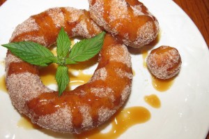 Cronuts with caramel sauce and cinnamon sugar